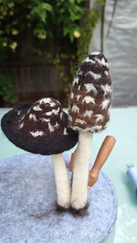 Needle-felted magpie inkcap mushrooms