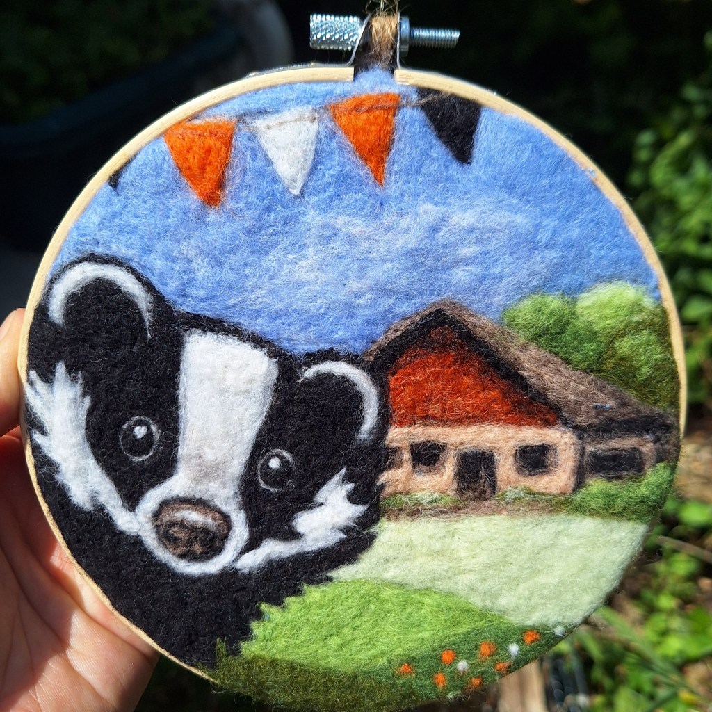 Needle-felted badger on a farm - picture