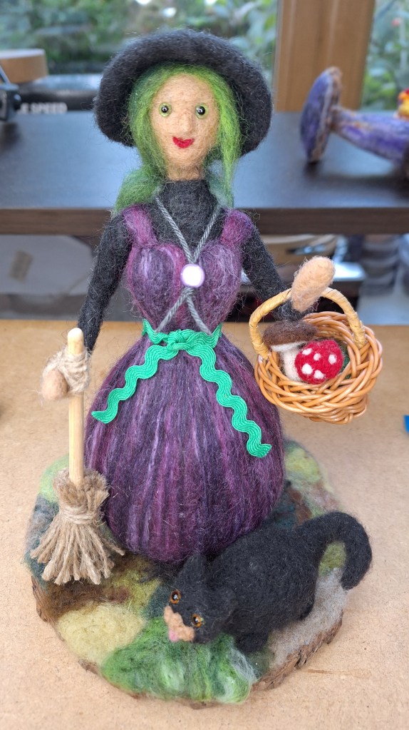Needle-felted Halloween witch with black cat 