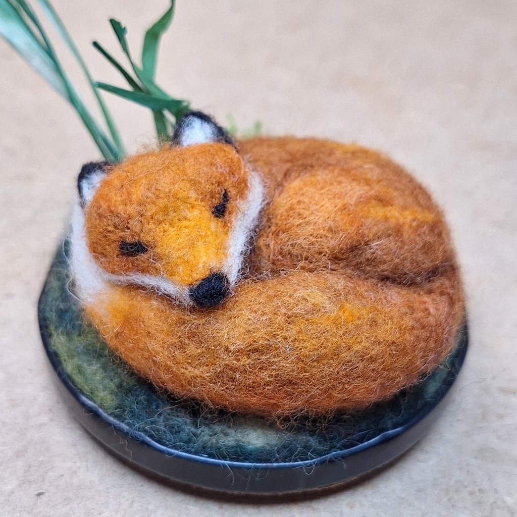 Needle-felted sleeping fox